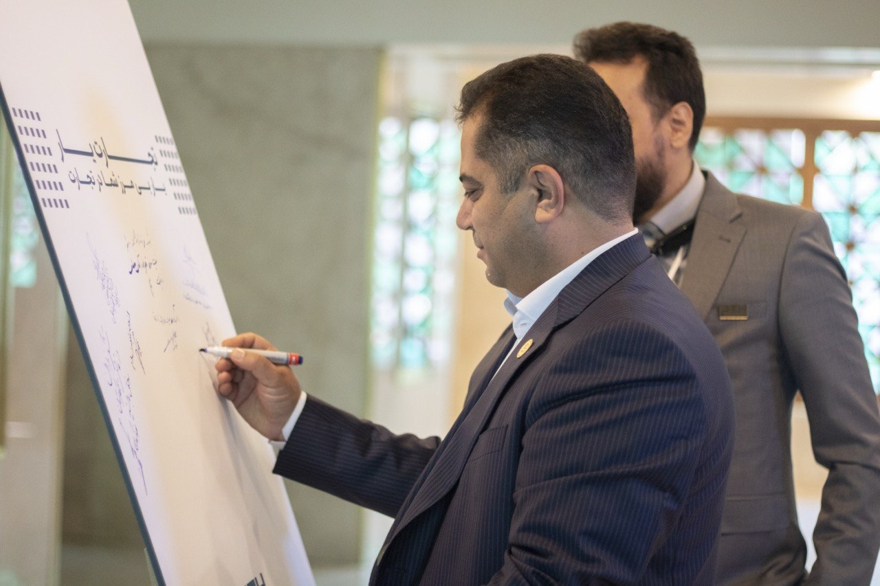Signing the founders wall